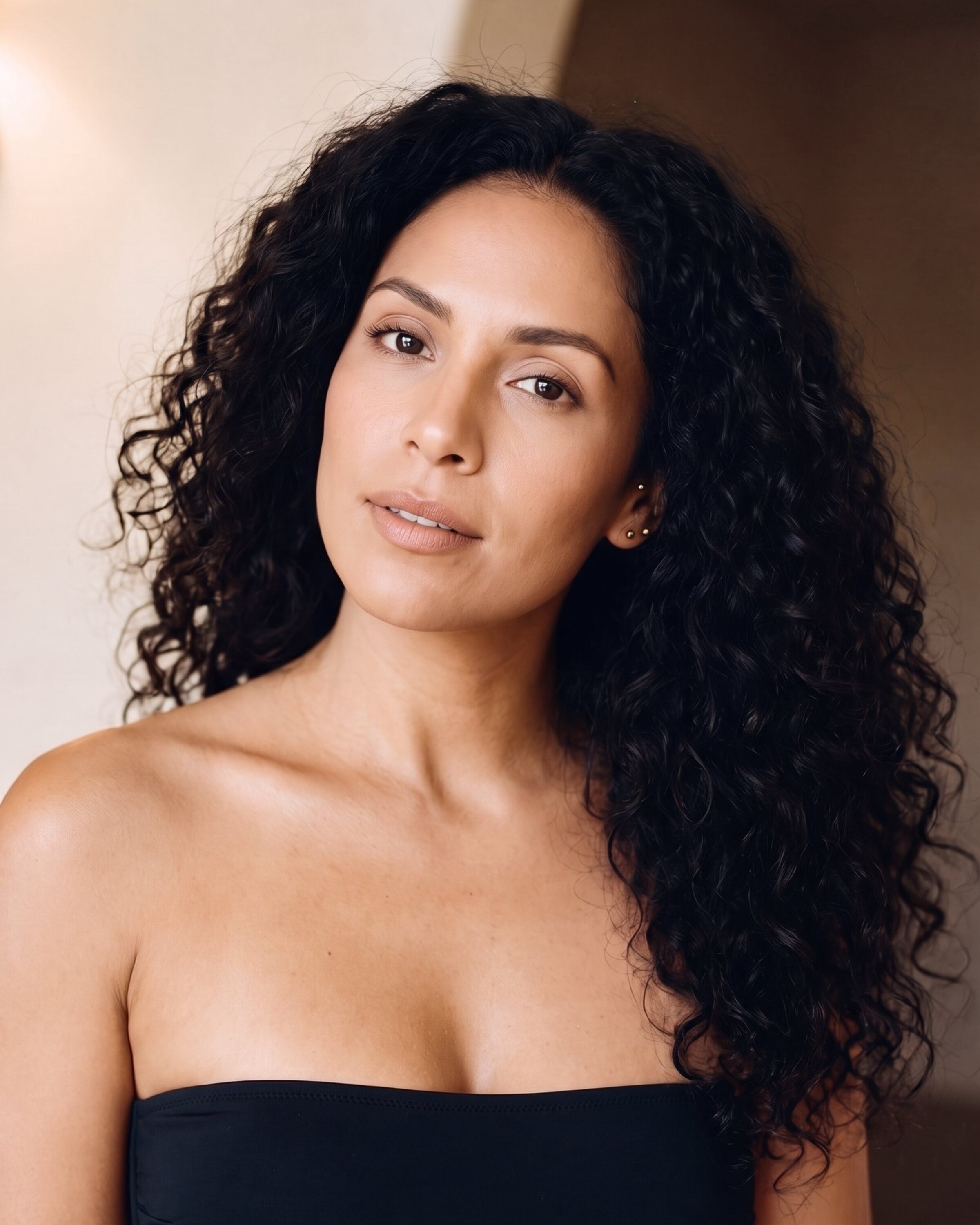 AI rendering: a woman with medium skin and dark curls, untanned, before a custom spray tan
