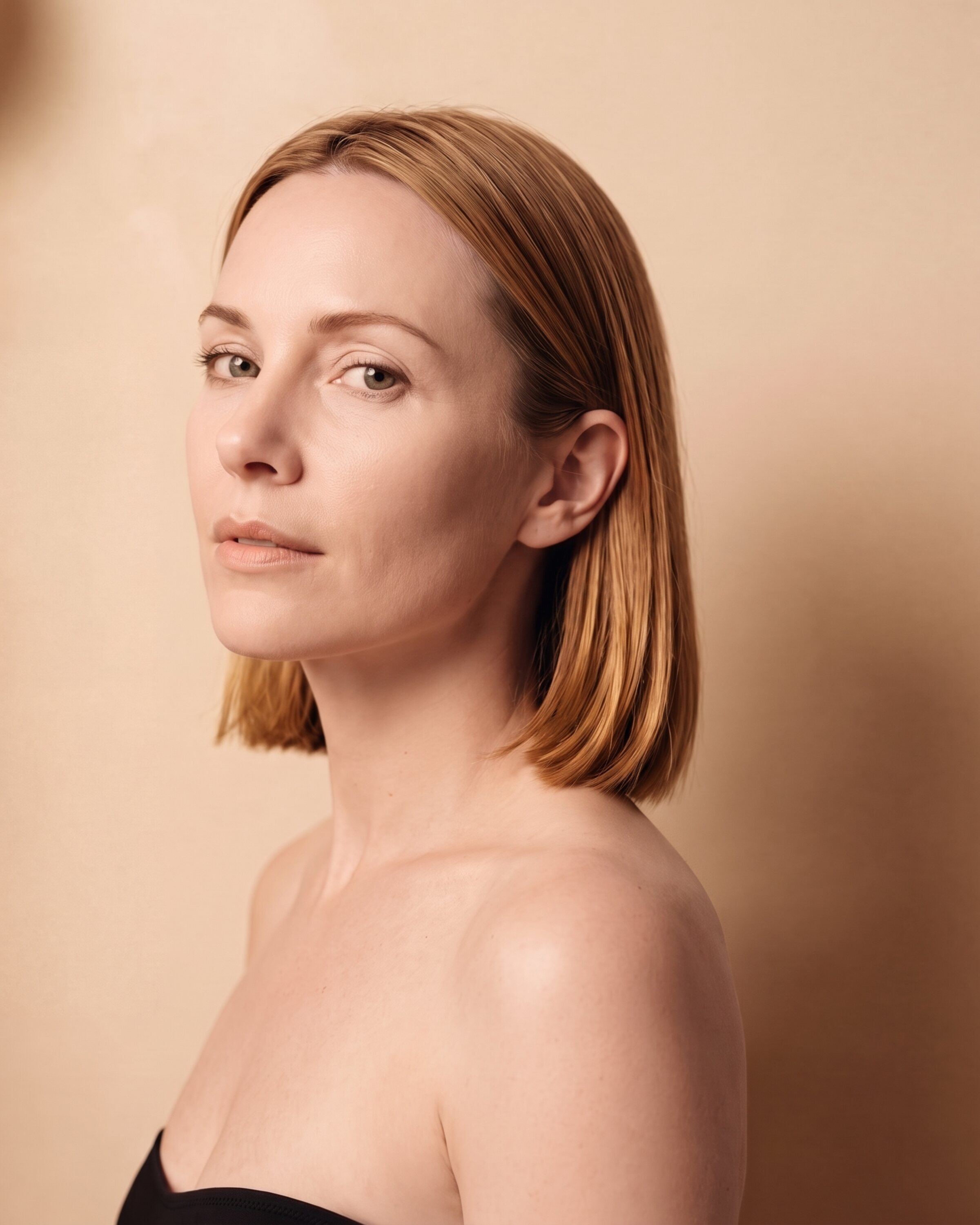 AI rendering: a woman with light skin and a honey-blonde lob, untanned, before a custom spray tan