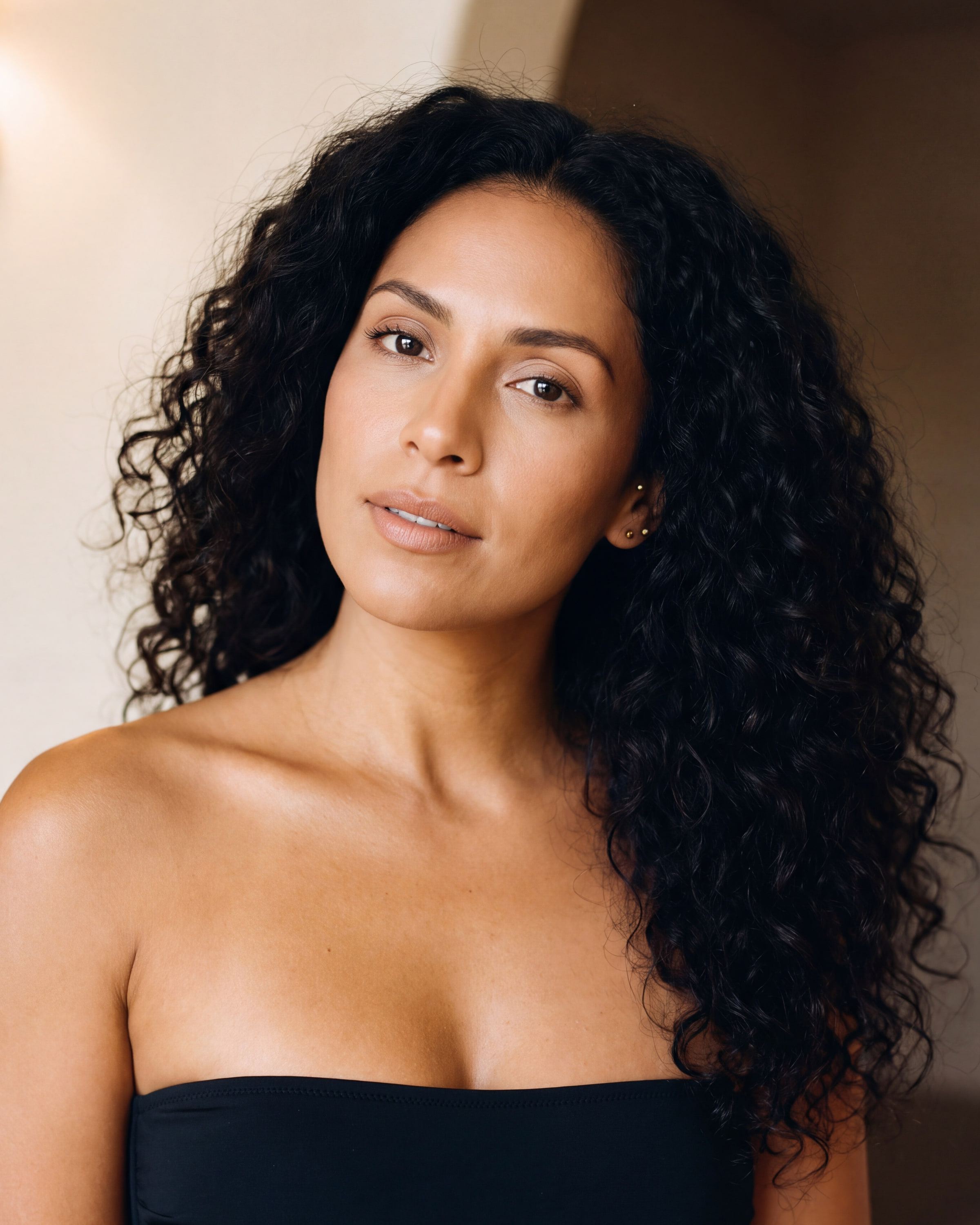 AI rendering: the same woman with medium skin after a rich custom spray tan